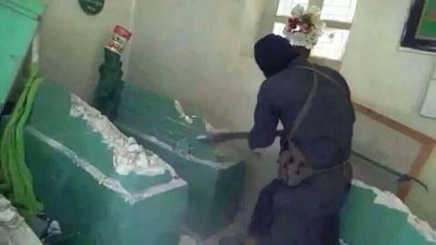 ISIS member smashes the tomb of the prophet Jonah